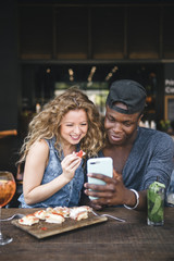 mixed race couple together in a restaurant