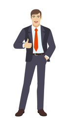 Businessman with hand in pocket  showing thumb up