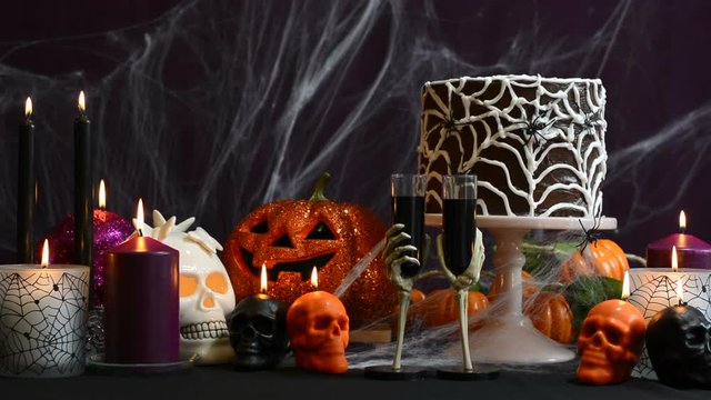 Spooky Halloween Party Table with chocolate spider cake, full table static.