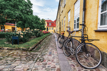 bicycles with baskets in a European courtyard