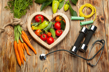 Vegetables in the heart. Diet, healthy lifestyle on a rustic wooden background - 169516098