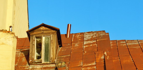 Rusty tin roof and dormer