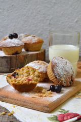 Oat Muffins with black currant on a cutting wooden background. Homemade baking. Healthy food.