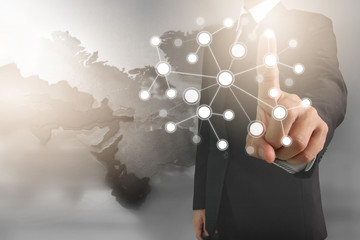 Businessman hand touching network connection