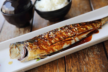 Grilled Mackerel fish with sauce , Saba yakitori on wood background , Japanese food