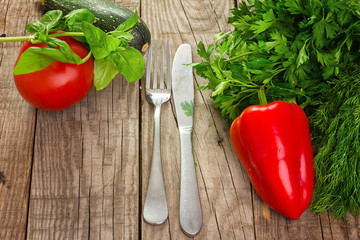 Fresh delicious ingredients for salad on wooden plate