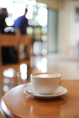 cappuccino coffee on wood background