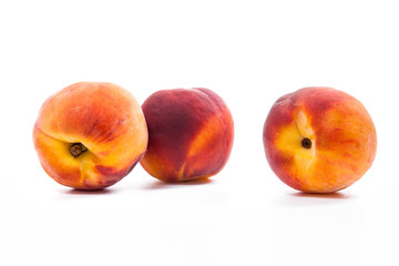 Group of ripe peach fruit isolated on white background.