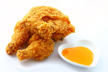 Fried chicken with sauce isolated over white
