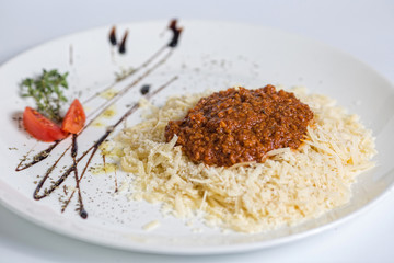 Spaghetti bolognese on white background