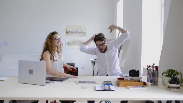 Beautiful designers in the office, happy to win a project.