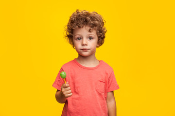 Adorable kid with lollipop