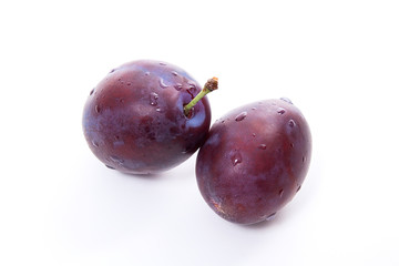 Group of ripe plums isolated on a white background..