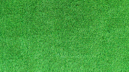 Artificial green grass texture for golf course. soccer field or sports background concept design. © phanthit malisuwan
