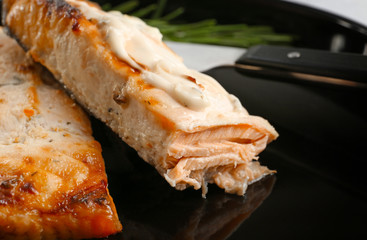 Delicious salmon with sauce, closeup