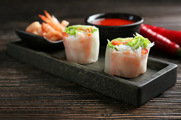 Fresh vegetable Vietnamese spring rolls with shrimps on table