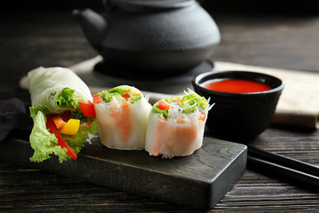 Fresh vegetable Vietnamese spring rolls with shrimps on table