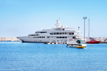 Fototapeta na wymiar Seascape with beautiful white yacht on sunny day