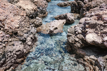 Sea coast with rocks on sunny day