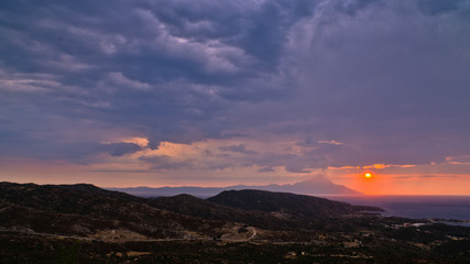 Stormy sky and sunrise at holy mountain Athos in Greece