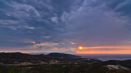 Stormy sky and sunrise at holy mountain Athos in Greece