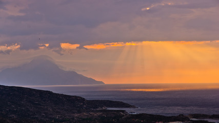 Stormy sky and sunrise at holy mountain Athos in Greece