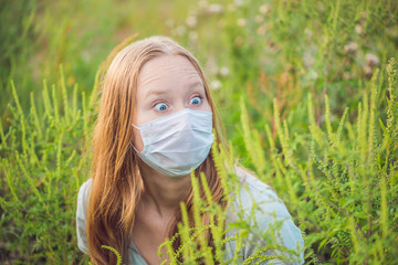 Young woman in a medical mask because of an allergy to ragweed