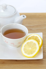 Cup of Lemon tea and fresh lemon slice