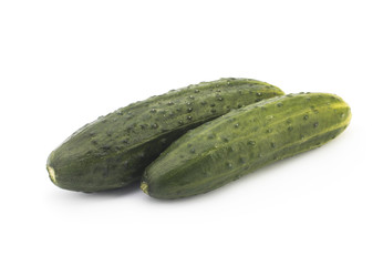 Green cucumbers on a white background
