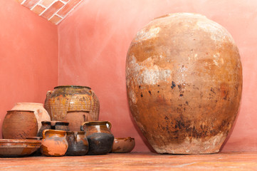 Amphoras, vases and old clay jugs in a rural house