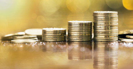 Website banner of shiny golden coins - money savings concept