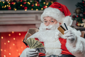 santa with credit cards and dollars