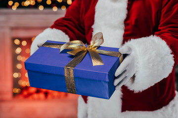 santa holding gift box