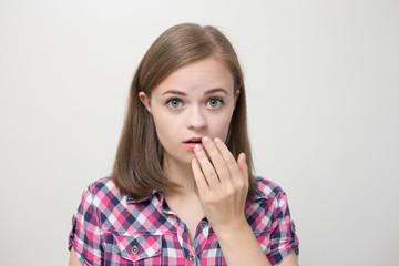 Caucasian girl surprised or scared, shocked, bewildered