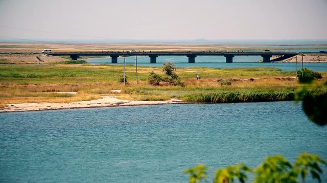 Bridge over Henichesk Strait also known as Tonkyi Strait, Ukraine, connecting Azov Sea and Syvash lake. Shot in August 2017. The Strait separates the Arabat Spit from the Ukrainian mainland. There are