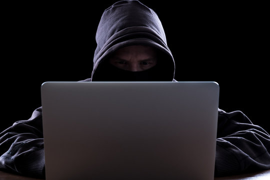 Anonymous hacker in the dark
