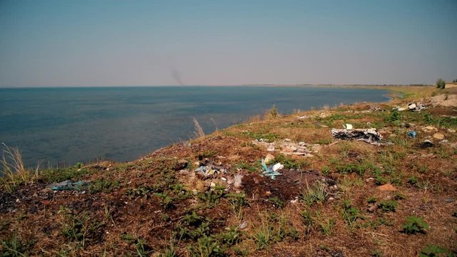 Trash on beach. Shot on Arabat Spit with view on Syvash lake, Ukraine