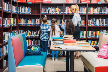 teacher with kids in library