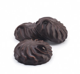 chocolate covered marshmallows, part of one bitten off, isolated on white background