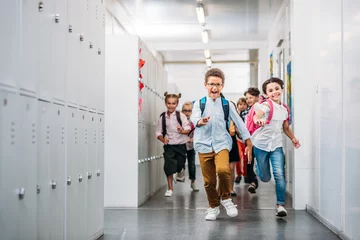 Foto op Aluminium pupils running through school corridor © LIGHTFIELD STUDIOS