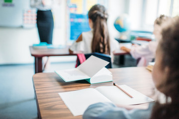 kids sitting at desks in class