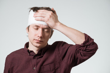 Man with bandage on his head