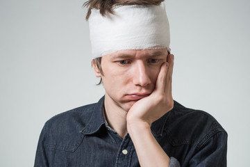 Man with bandage on his head