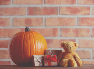 Autumn pumpkin and Teddy Bear with gifts