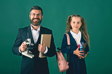 Girl and man in suit and school uniform
