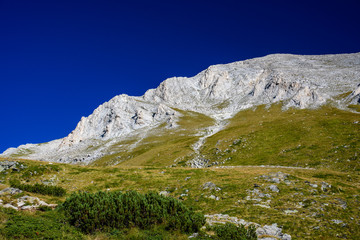 Fototapeta na wymiar Beautiful high contrast mountain landscape - Pirin mountain, Bulgaria - popular trekking route, amazing scenery