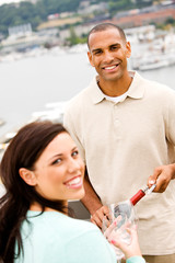 Wine: Smiling Man And Woman About To Share Glass Of Wine