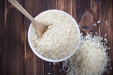 Rice spoon plate Wooden table background
