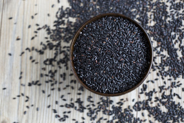 Top view of black rice on the table.