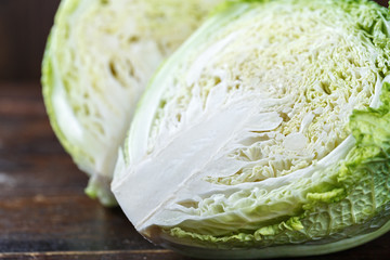 Savoy cabbage on a wooden background